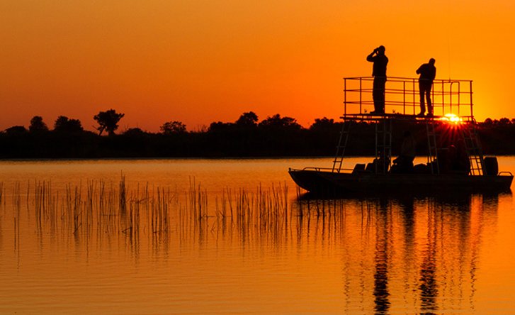 Boat cruise on the river at sunset